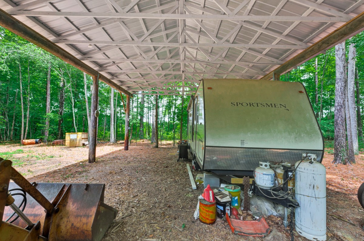 1218 Johnson Branch Road Pulaski, TN 38478 - Photo 19 of 23 a room with lots of trees and couches