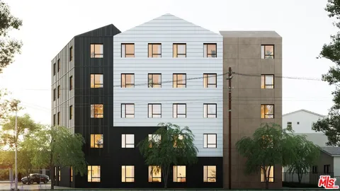 a front view of a residential apartment building with a yard