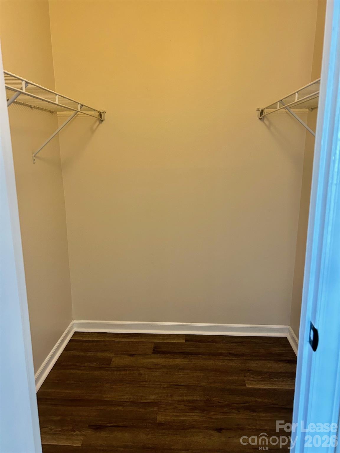 11028 Harrowfield Road Charlotte, NC 28226 - Photo 11 of 15 a view of a room with wooden floor and cabinet
