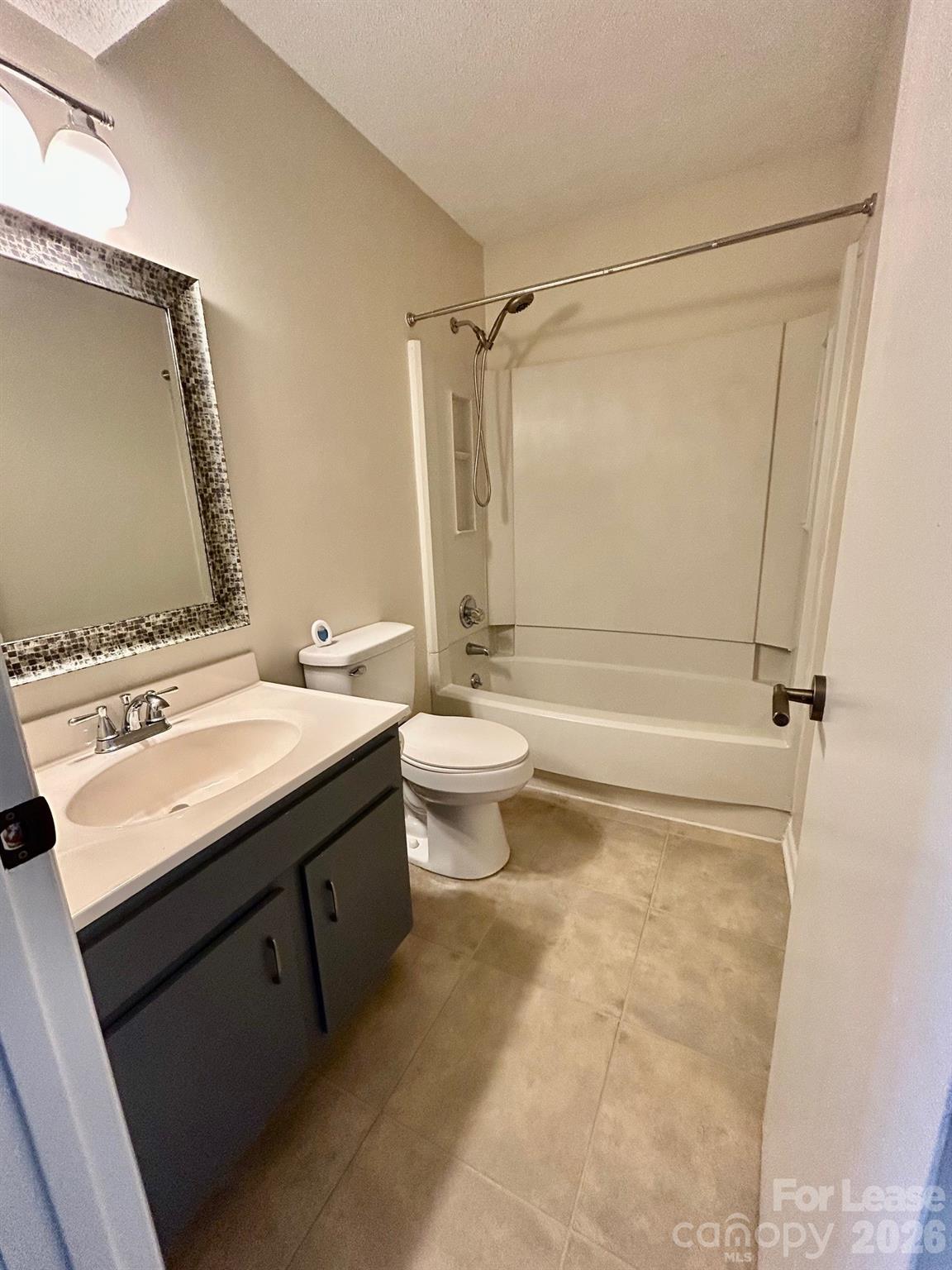11028 Harrowfield Road Charlotte, NC 28226 - Photo 13 of 15 a bathroom with a sink a toilet and shower