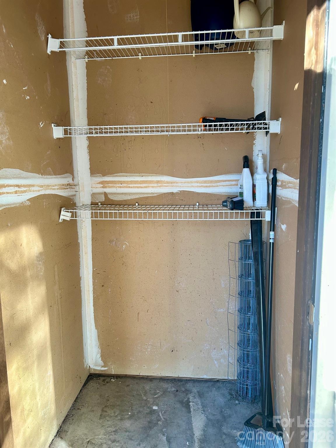 11028 Harrowfield Road Charlotte, NC 28226 - Photo 15 of 15 a view of a room with racks on the wall