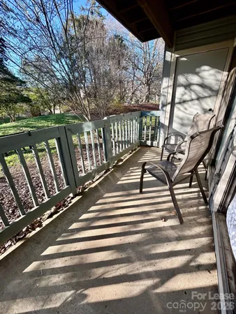 a view of balcony with furniture