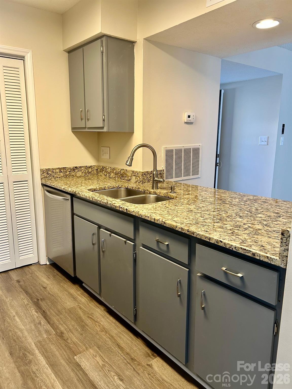 11028 Harrowfield Road Charlotte, NC 28226 - Photo 4 of 15 a view of a kitchen with sink and cabinets