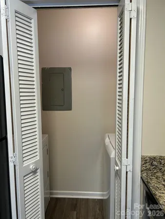 a view of a hallway with a door and a window
