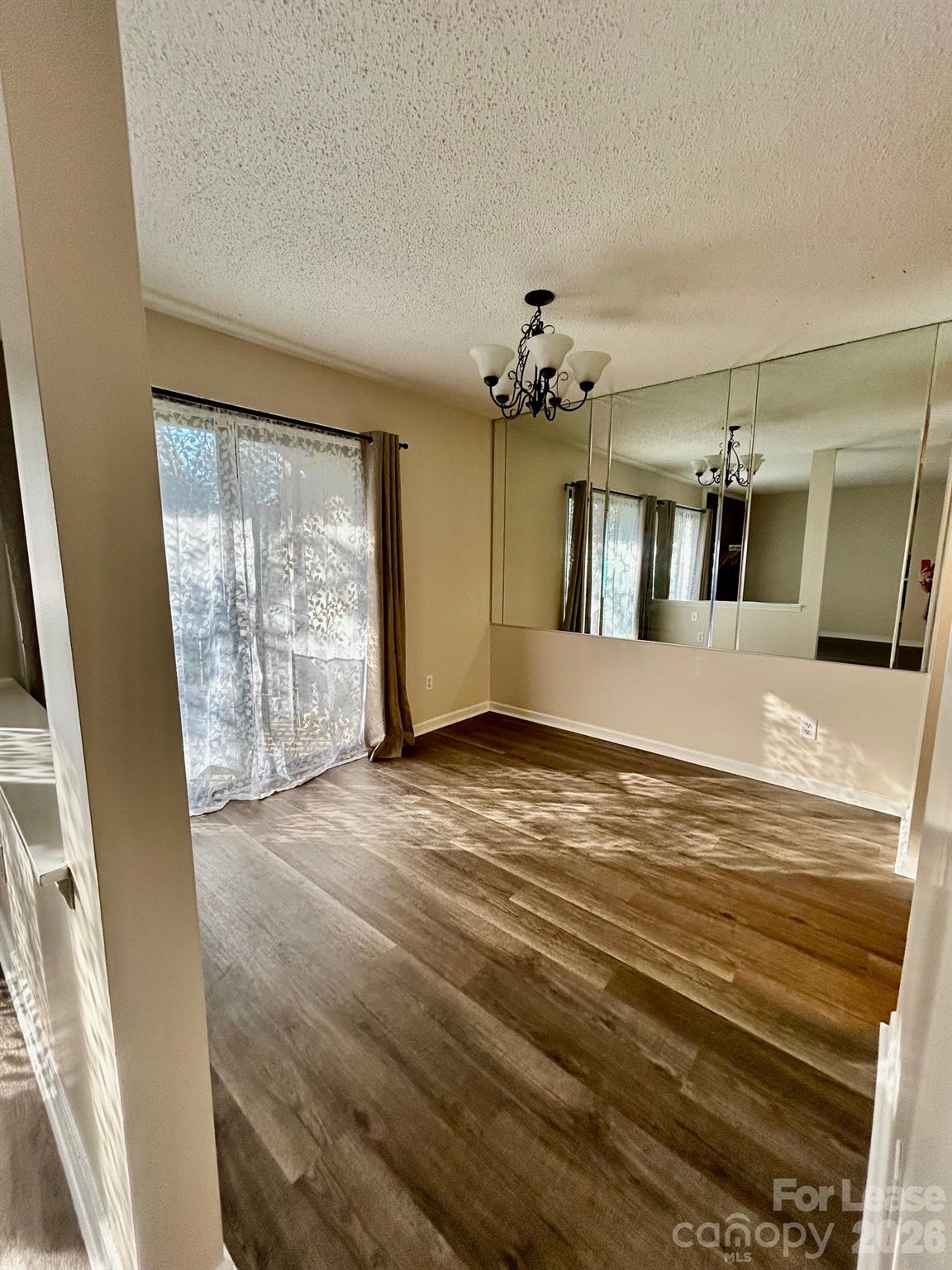 11028 Harrowfield Road Charlotte, NC 28226 - Photo 7 of 15 a view of an empty room with a window