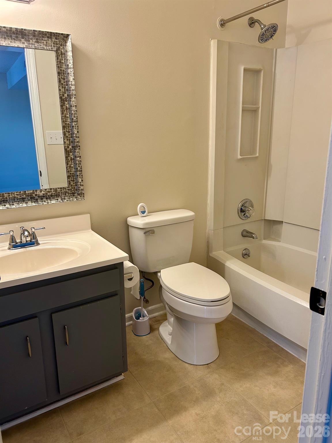 11028 Harrowfield Road Charlotte, NC 28226 - Photo 9 of 15 a bathroom with a sink a toilet and shower