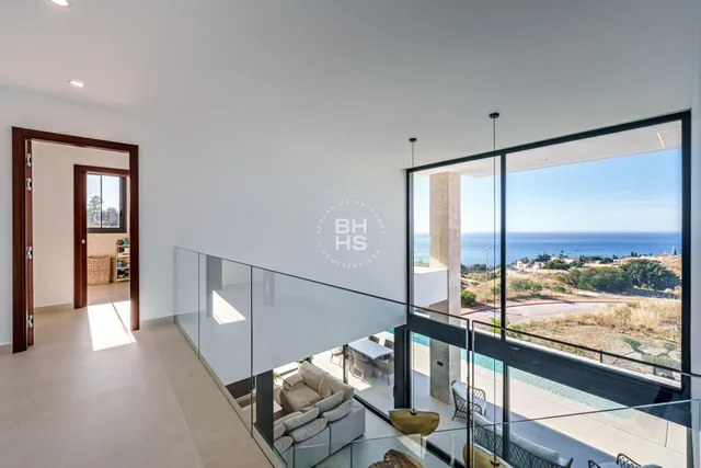 a view of a living room with a large window