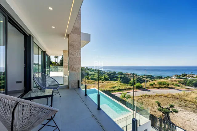 a view of balcony with furniture