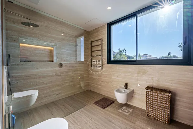 a spacious bathroom with a double vanity sink and a mirror