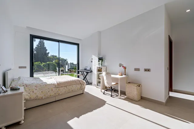 a bathroom with a toilet a sink and a mirror