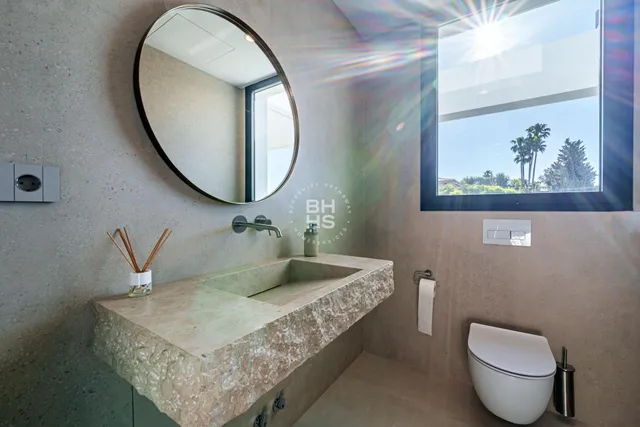 a bathroom with a double vanity sink mirror and shower