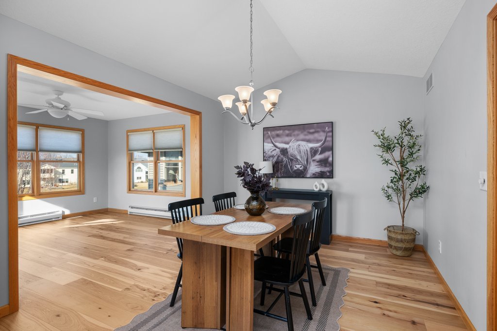 1126 West Le Claire Road Eldridge, IA 52748 - Photo 18 of 44 a view of a dining room with furniture and chandelier