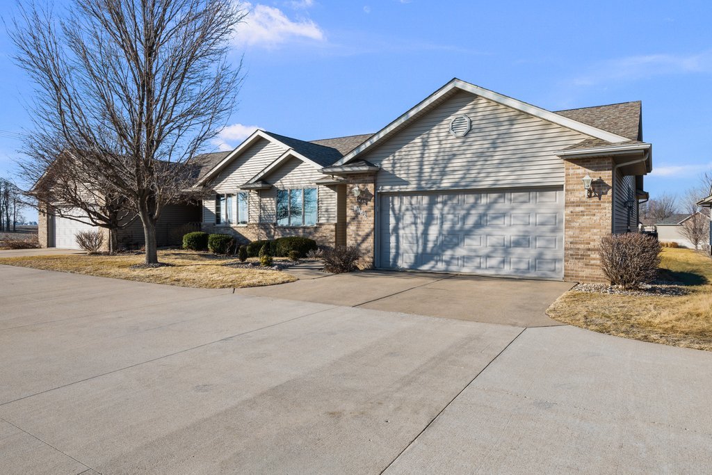 1126 West Le Claire Road Eldridge, IA 52748 - Photo 2 of 44 a front view of a house with a yard