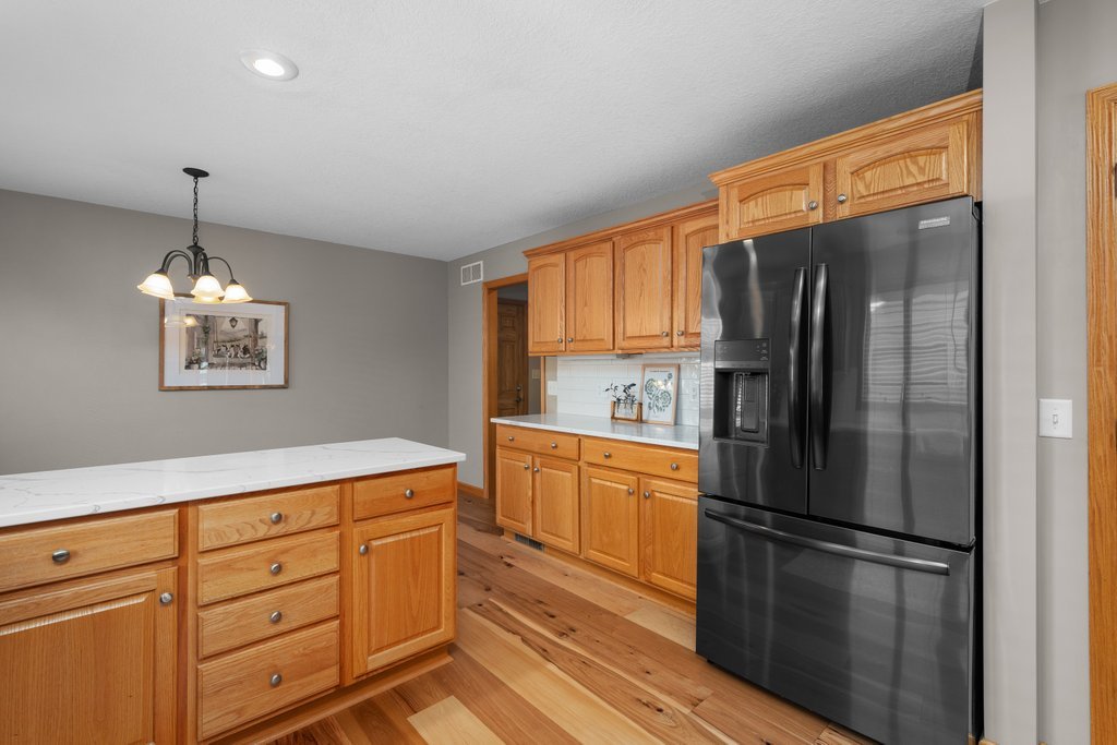 1126 West Le Claire Road Eldridge, IA 52748 - Photo 28 of 44 a kitchen with stainless steel appliances a refrigerator sink and microwave