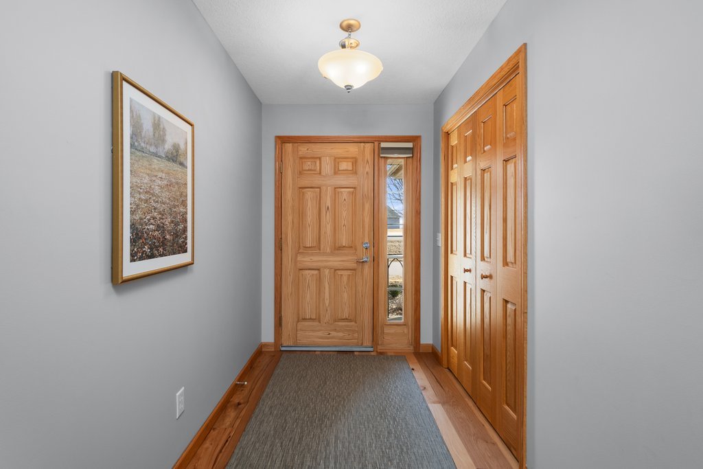 1126 West Le Claire Road Eldridge, IA 52748 - Photo 4 of 44 a view of a hallway with front door