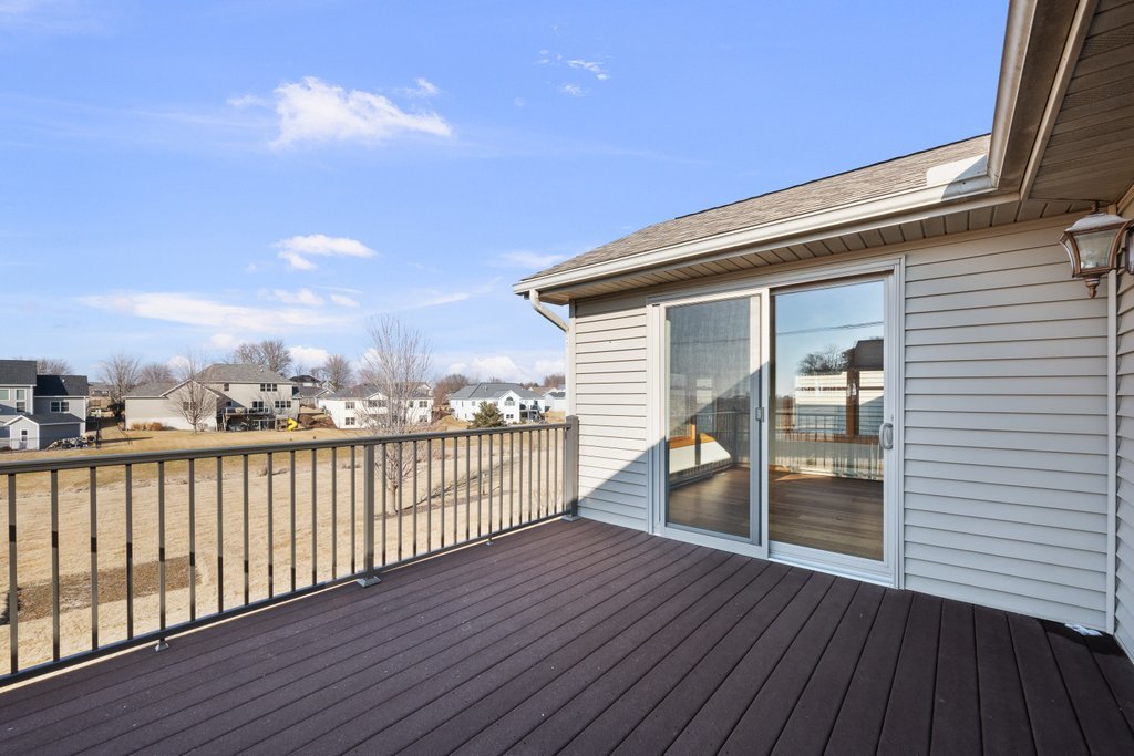 1126 West Le Claire Road Eldridge, IA 52748 - Photo 41 of 44 a view of a balcony with wooden floor
