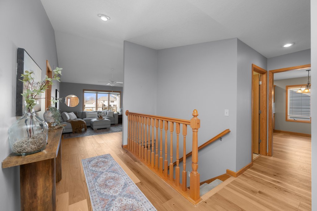 1126 West Le Claire Road Eldridge, IA 52748 - Photo 5 of 44 a view of a livingroom with wooden floor and furniture