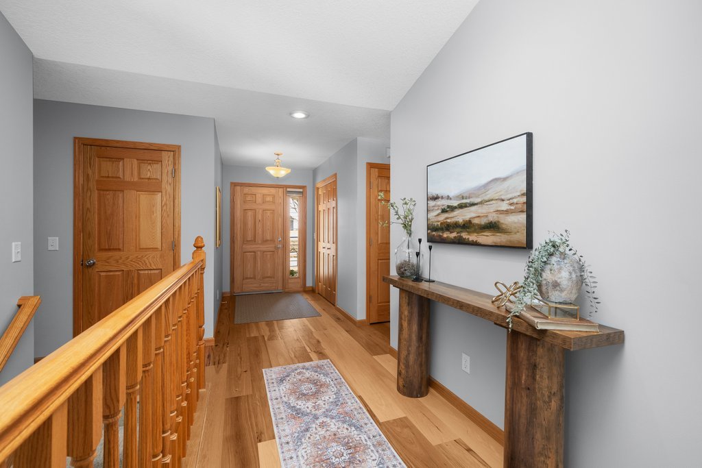 1126 West Le Claire Road Eldridge, IA 52748 - Photo 6 of 44 a view of a hallway with wooden floor