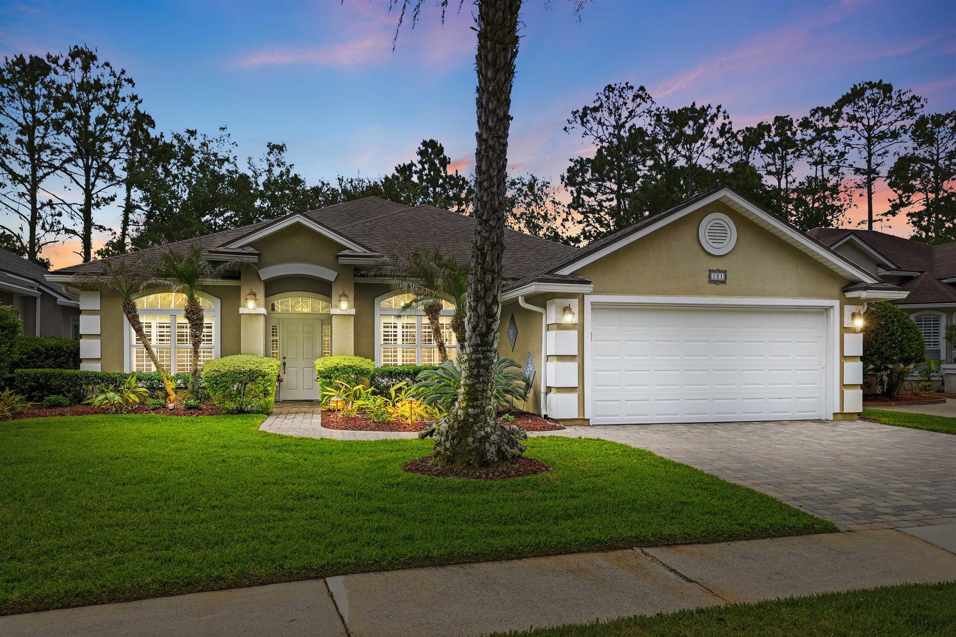 121 Edge Of Woods Road St. Augustine, FL 32092 - Photo 2 of 53 a front view of a house with garden