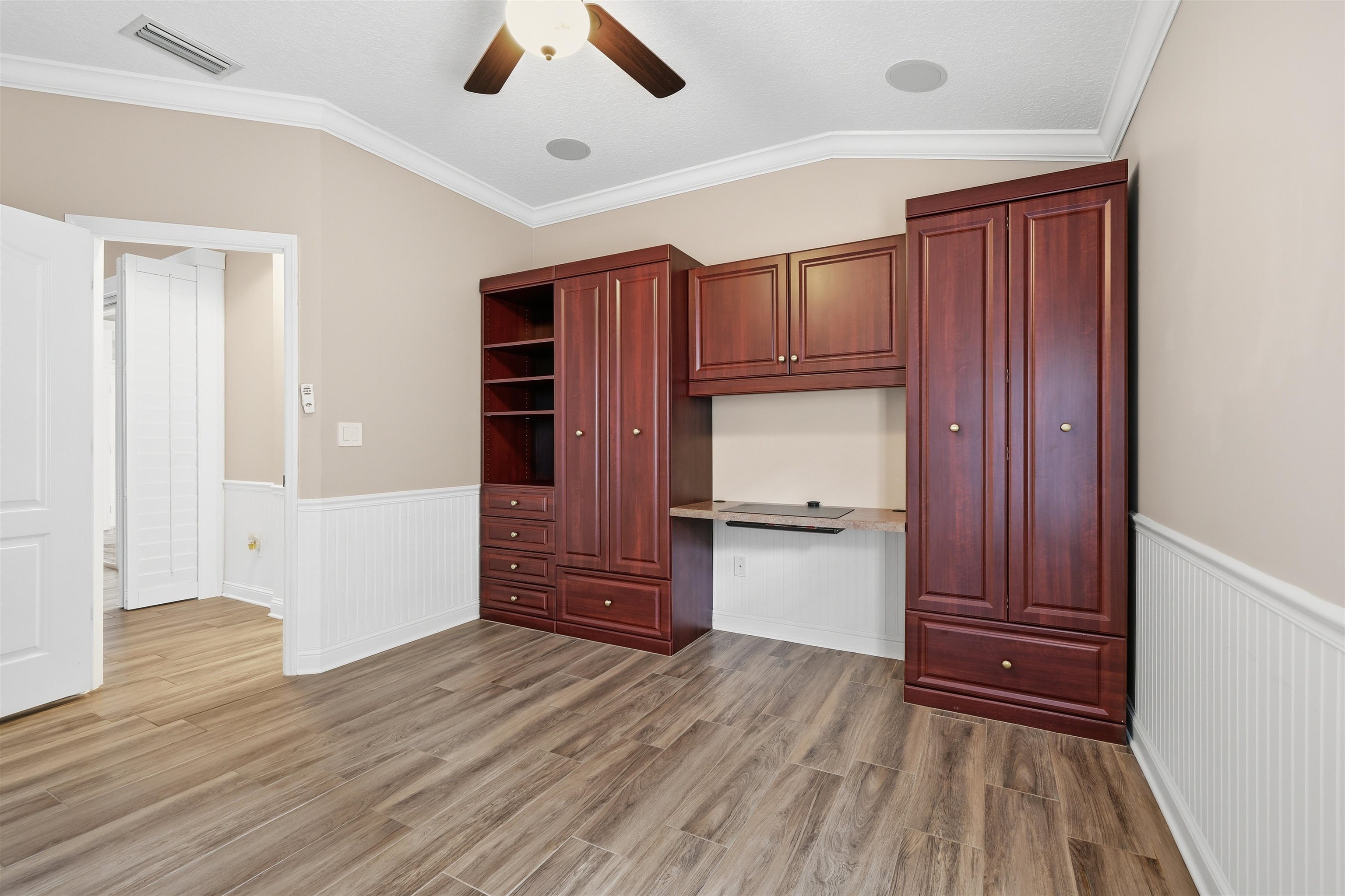 121 Edge Of Woods Road St. Augustine, FL 32092 - Photo 34 of 53 a kitchen with a refrigerator and wooden floor