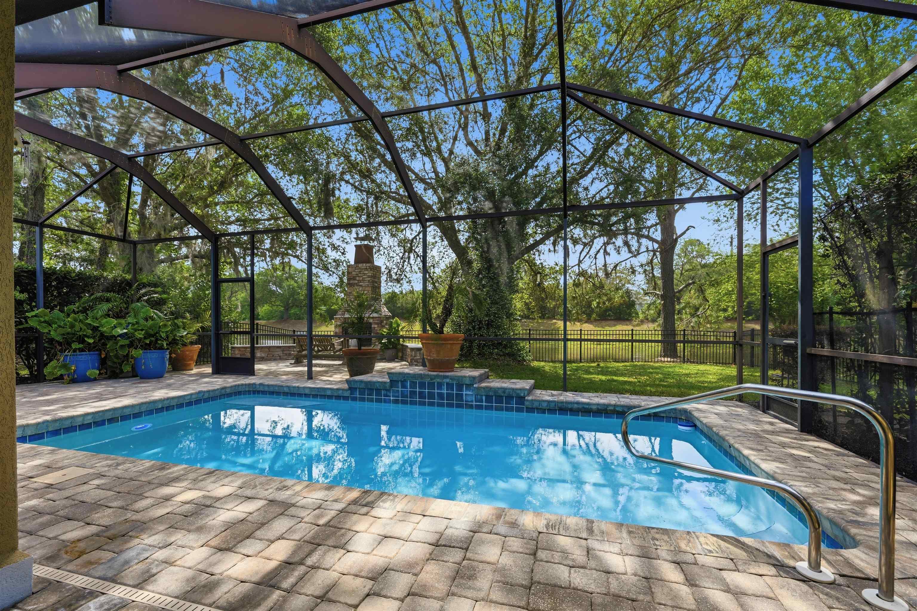 121 Edge Of Woods Road St. Augustine, FL 32092 - Photo 39 of 53 a view of a swimming pool with a patio