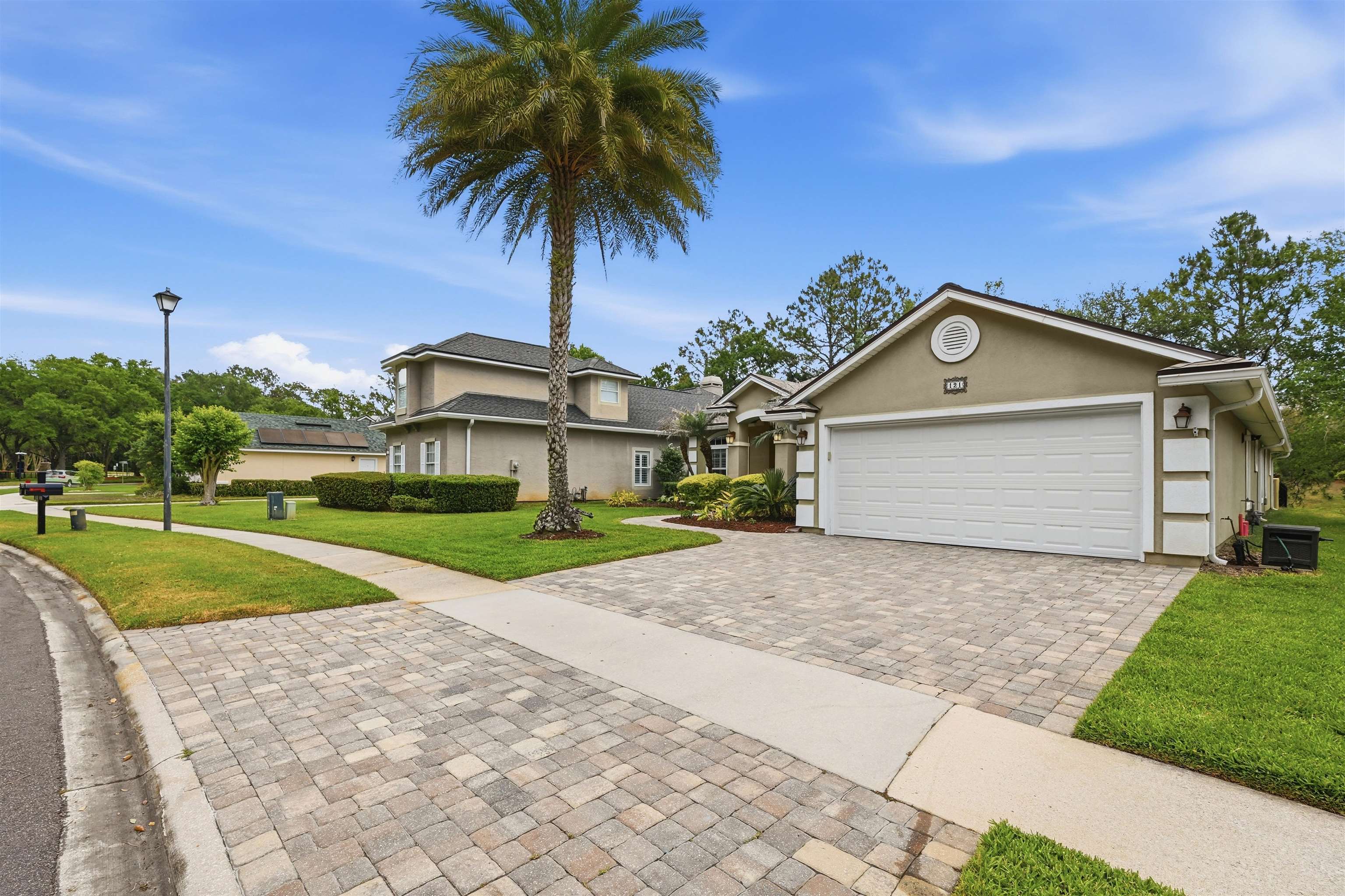 121 Edge Of Woods Road St. Augustine, FL 32092 - Photo 46 of 53 a front view of a house with a yard and garage