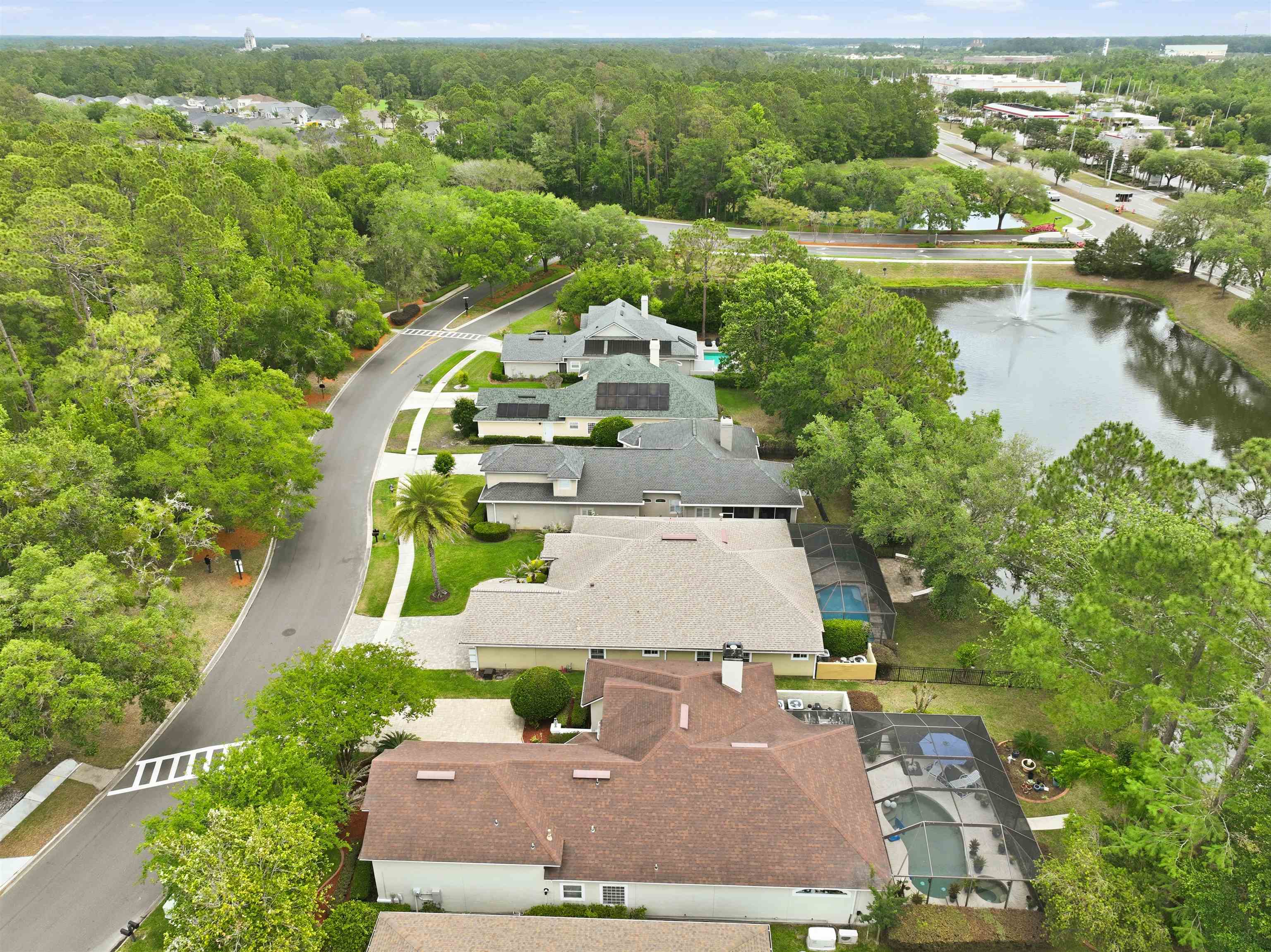 121 Edge Of Woods Road St. Augustine, FL 32092 - Photo 52 of 53 an aerial view of a house with a garden and lake view