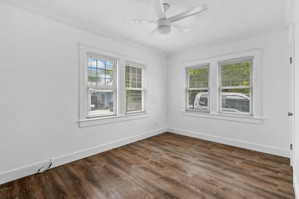 a view of livingroom with furniture window and wooden floor