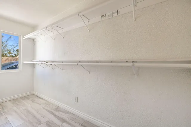 a view of an empty walk in closet