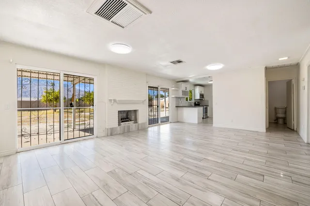a view of a livingroom with wooden floor