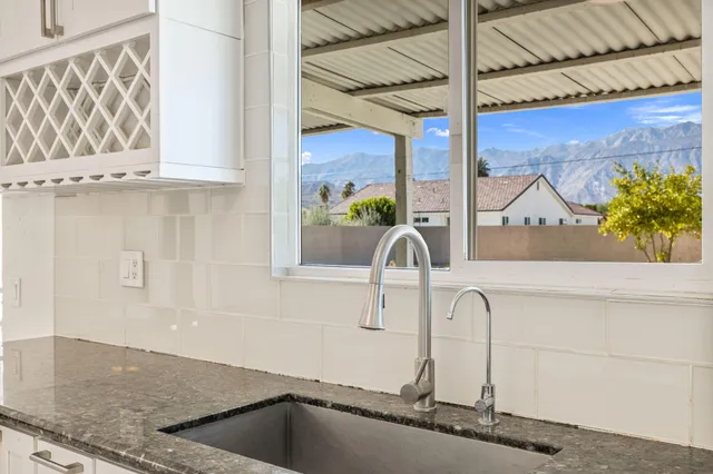 a kitchen with a sink and a window