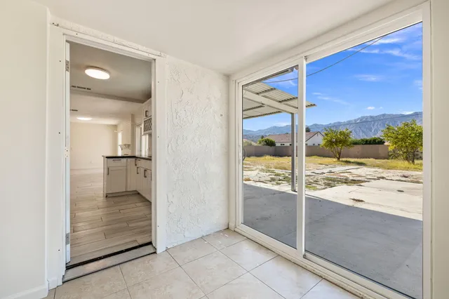 wooden floor with a view of a living room