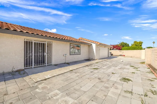 a very nice looking house with a large window