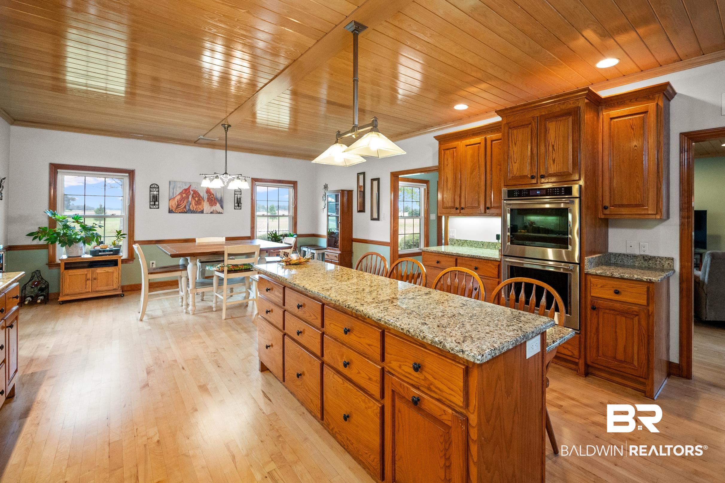 13871 Underwood Road Summerdale, AL 36580 - Photo 5 of 33 Kitchen with decorative light fixtures, light hardwood / wood-style flooring, and a wealth of natural light