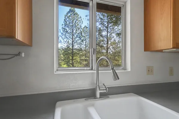 a bathroom with a sink and a window