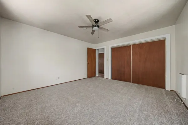 a view of an entryway with wooden floor and stairs