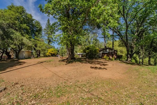 a view of outdoor space with deck and yard