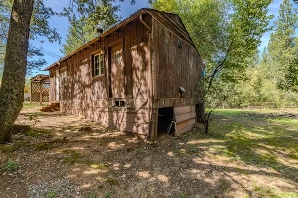a view of a house with a tree