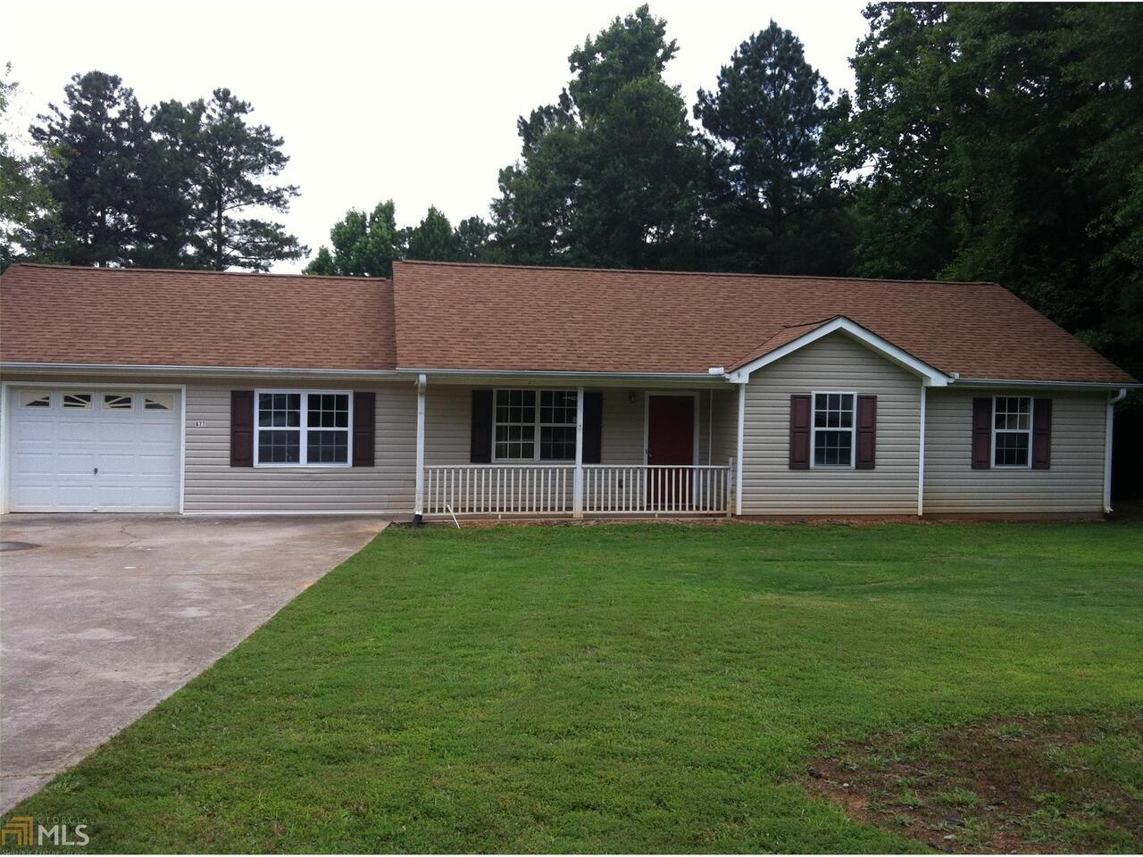 677 Wesley Chapel Road, Unit 1 Villa Rica, GA 30180 - Photo 1 of 1 a front view of a house with a garden