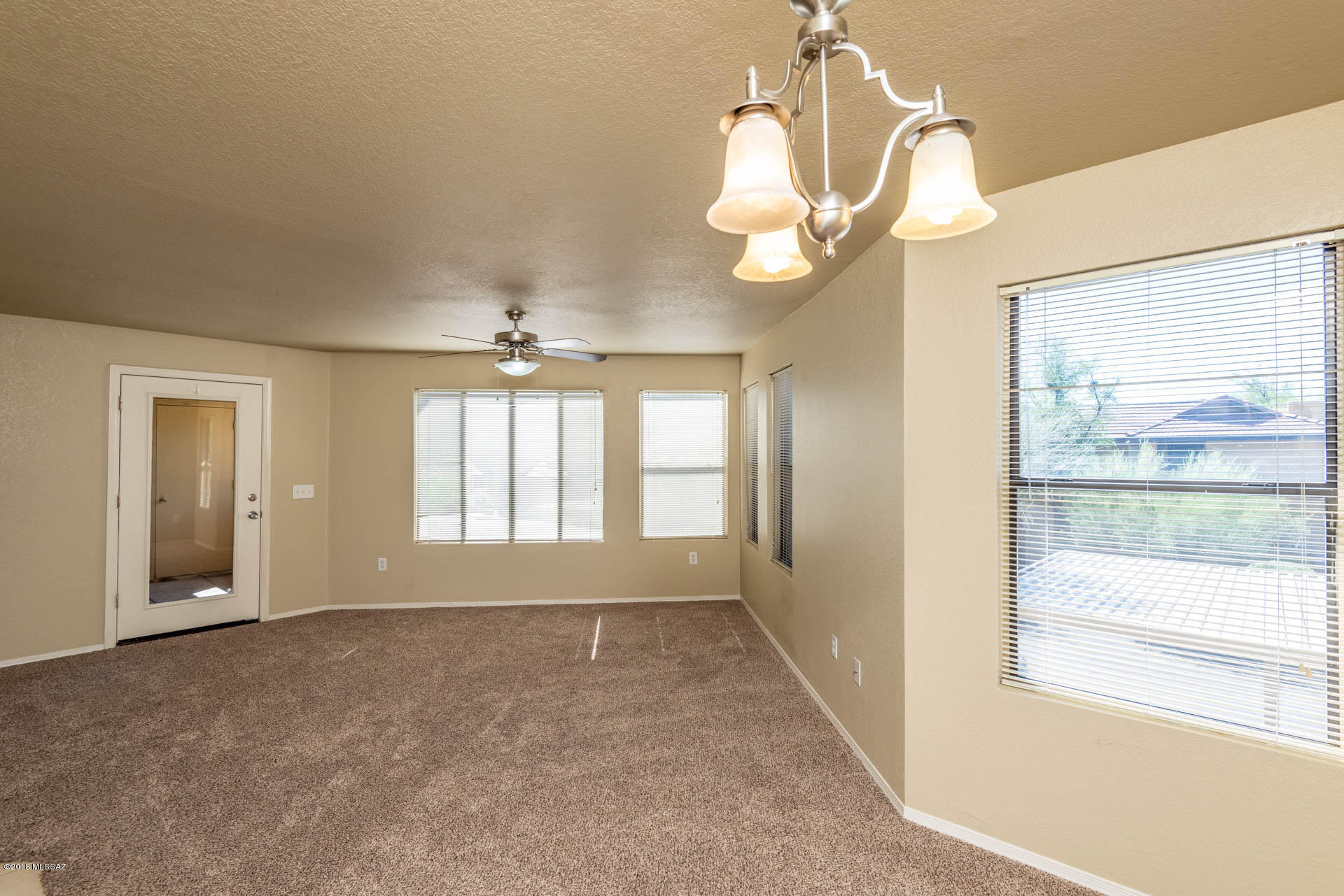 7255 East Snyder Road, Unit 8205 Tucson, AZ 85750 - Photo 5 of 23 a view of an empty room with a window