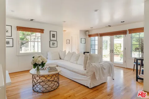 a spacious bedroom with a bed and window