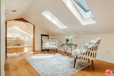 a bathroom with a sink a mirror and a shower