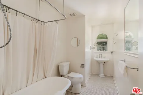 a front view of house with yard and trees