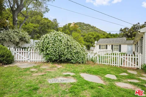 a kitchen with stainless steel appliances granite countertop a sink stove and wooden floor