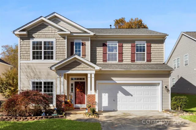 front view of a house with a yard