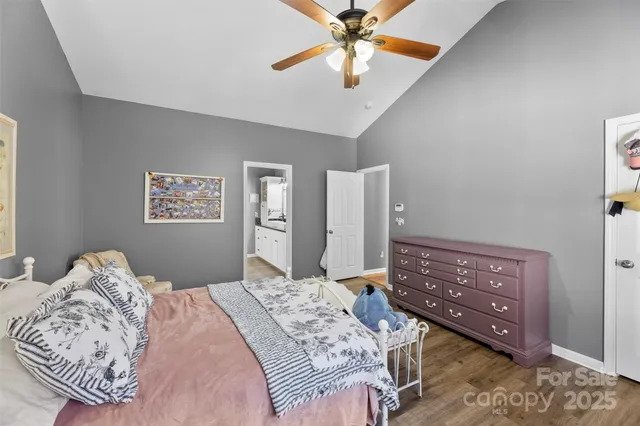 a bedroom with a bed dresser and a window