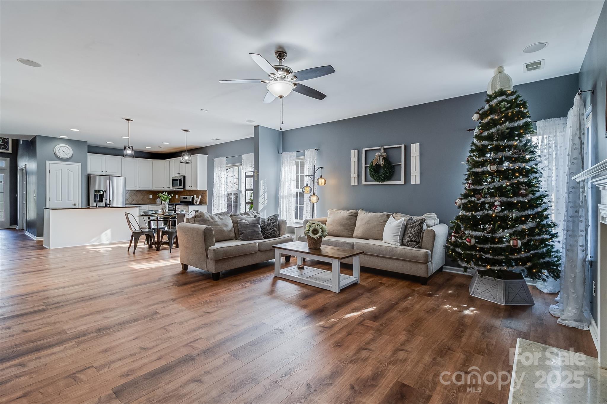 224 Morning Dew Lane Mount Holly, NC 28120 - Photo 16 of 48 a living room with furniture and a large mirror