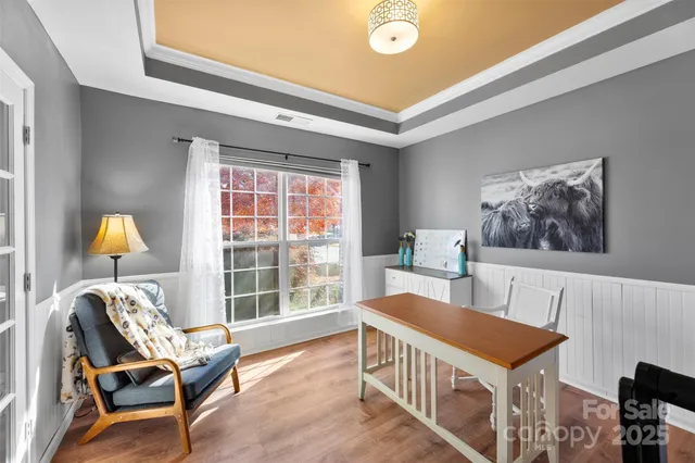 a bedroom with furniture and a window