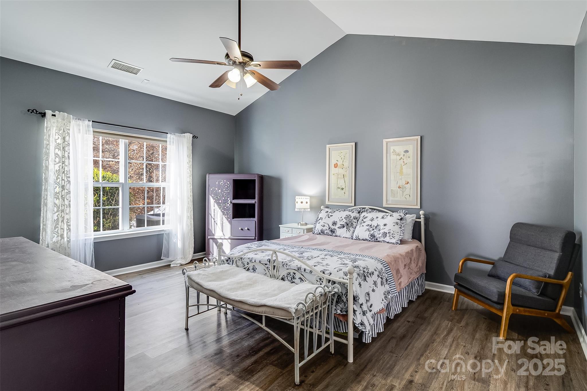 224 Morning Dew Lane Mount Holly, NC 28120 - Photo 19 of 48 a bedroom with a bed and a table in it