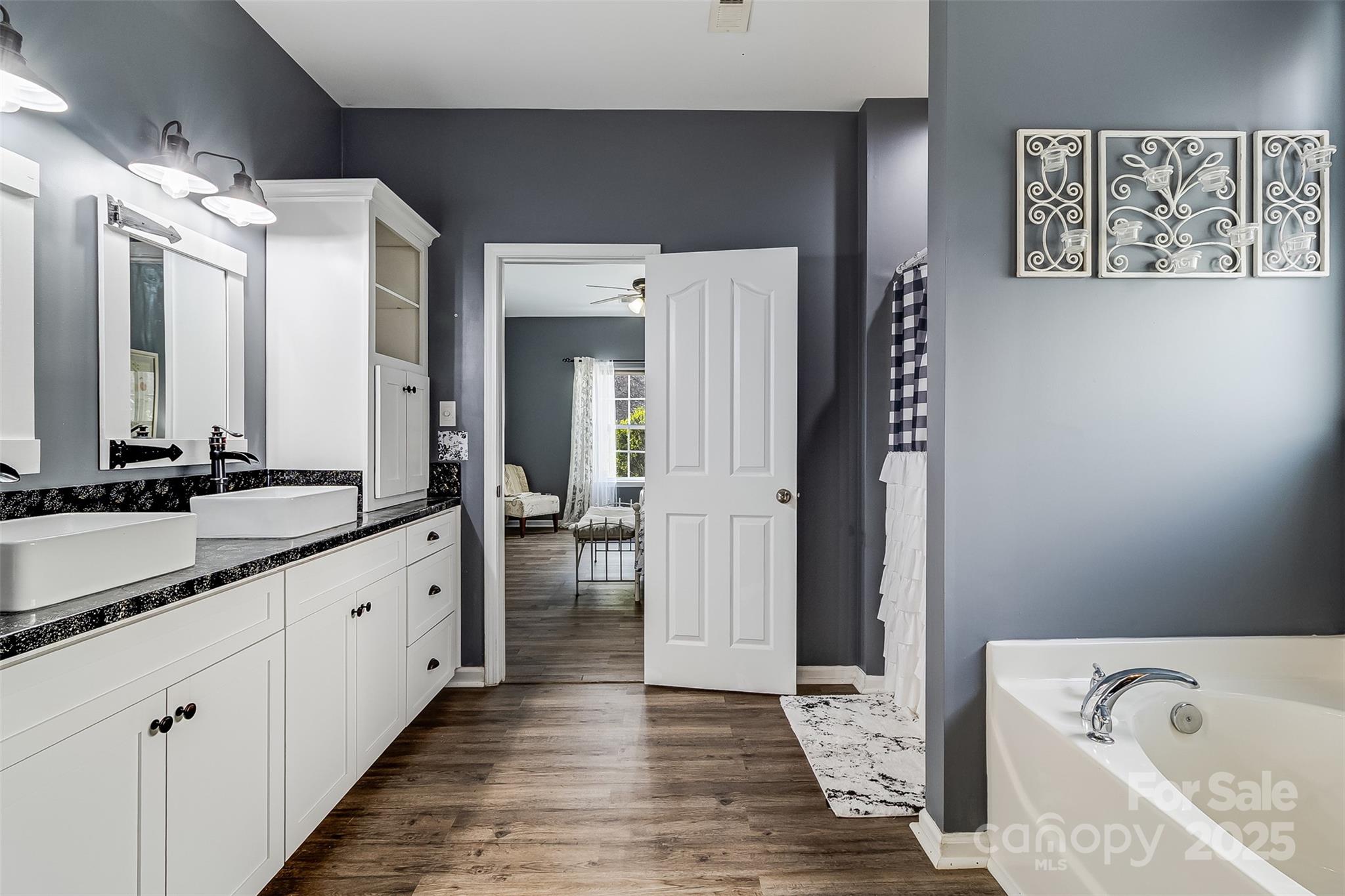 224 Morning Dew Lane Mount Holly, NC 28120 - Photo 22 of 48 a large bathroom with a tub sink and mirror